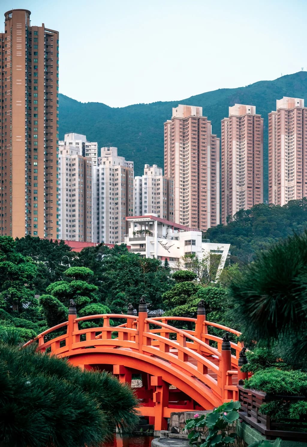 a red bridge in a park