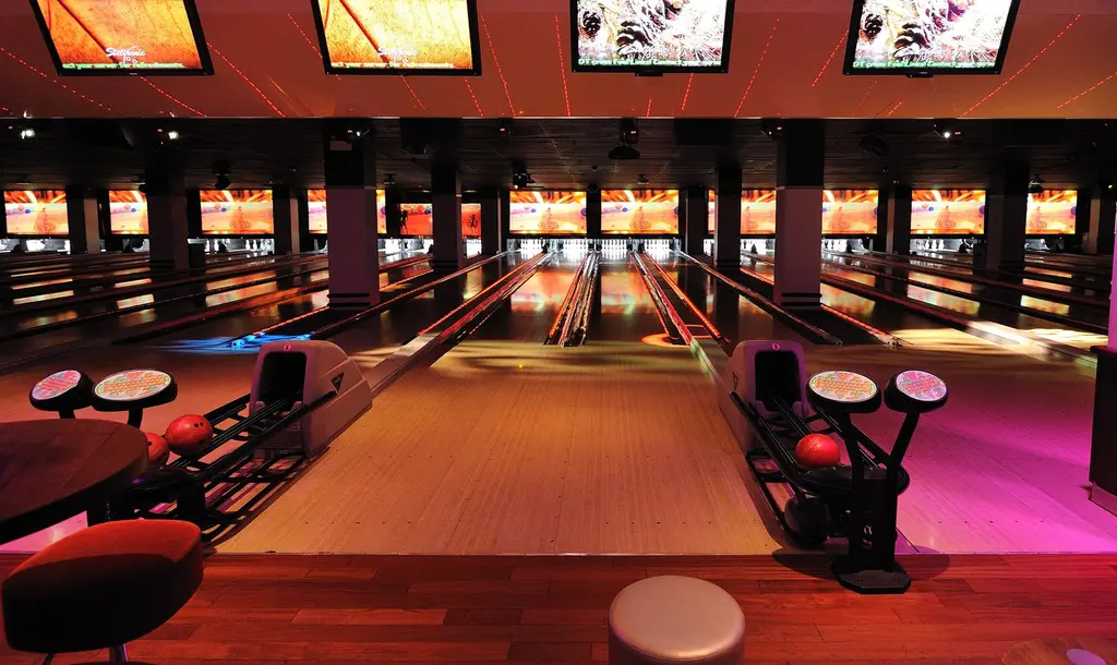 a bowling alley with different colored lights on it